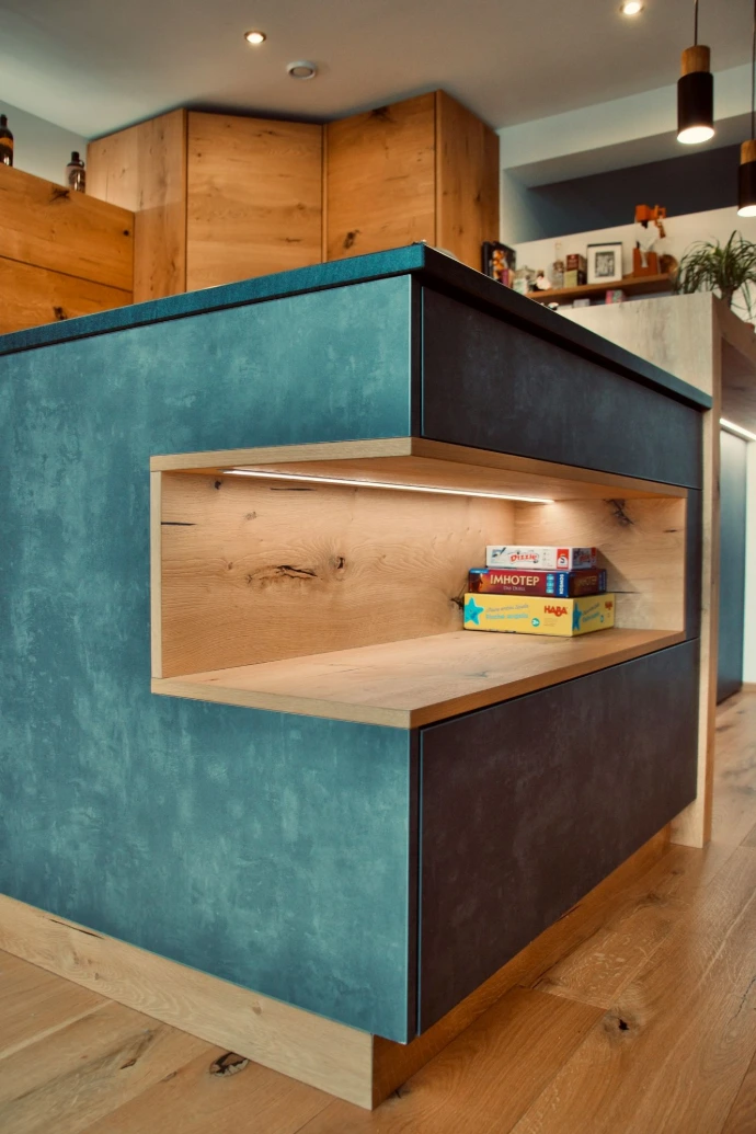 a blue shelf with books on top of it